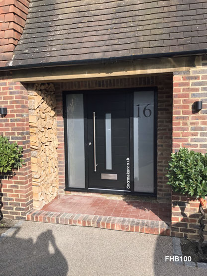 black contemporary door and frame with sidelights
