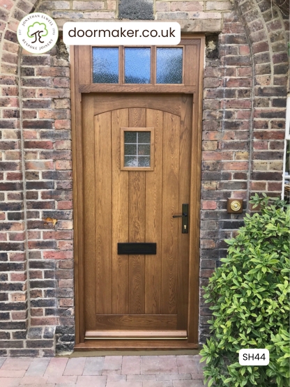 oak cottage door with swept head and toplight